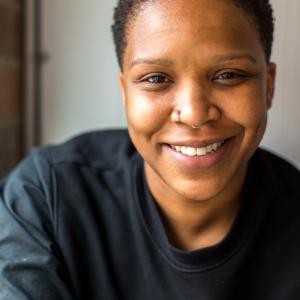 A black woman with short hair.